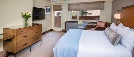 This sumptuous Guest Room is perfect for a romantic getaway, featuring rich decor and modern amenities.