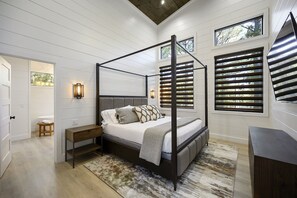 Private mater bedroom with treetop views and supportive yet cozy bedding