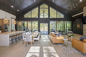Expansive great room joins kitchen, dining and living room.