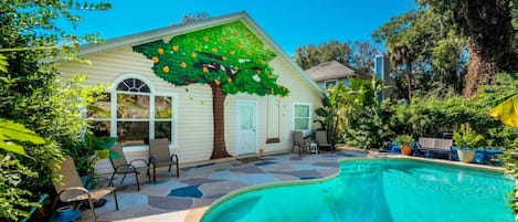Enjoy the perfect blend of luxury and nature with a heated pool surrounded by lush landscaping – ideal for a refreshing escape.