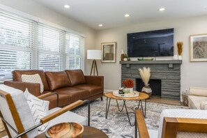 The family room from the entry area with 60" Samsung smart TV (byo logins)