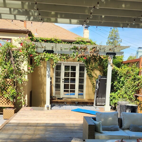 Entry from large back deck and outdoor kitchen