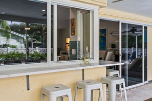 Pass through kitchen window with bar seating 