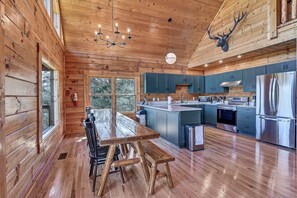A large dining picnic table is perfect for large groups. We have also added 3 stools for the kitchen island for more seating.