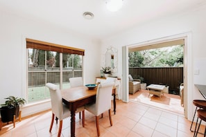  The open plan dining room flows to the undercover patio creating a beautiful transition between indoors and out.
