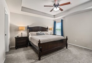 Cozy king bed is the perfect place to unwind.