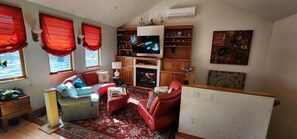 Living room, tv and surround sound, board games in the cabinets.