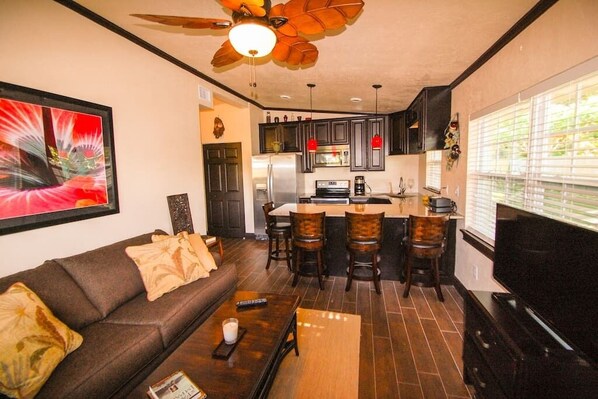 Family room from front entry, with pull out sleeper sofa and HDTV