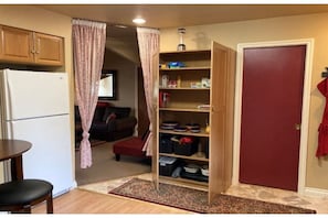 View of kitchen and cooking/ eating supplies/ utensils