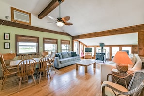 Open living area highlighted by a wood burning stove located upstairs