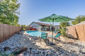 Create lots of memories in our spacious backyard with a fenced pool and hot tub and covered patio with plenty of seating.