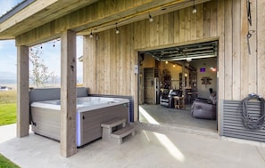 Hot tub outside of man cave with bar
