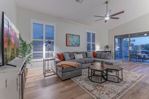 Cozy great room features a comfortable sectional for watching the TV.