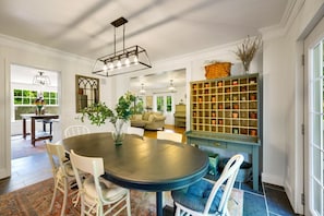 View from dining room into kitchen, furnished with antique mail sorter