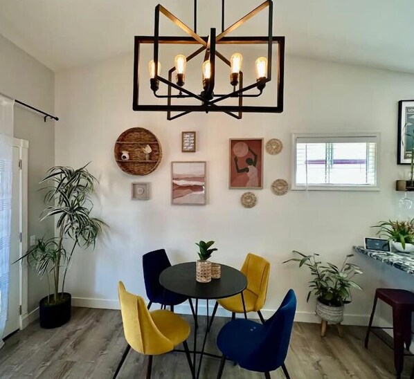 Dining room features a lovely hanging chandelier