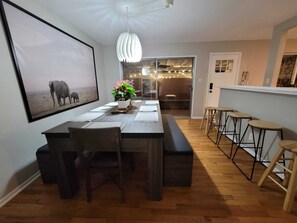 Large dining are with breakfast bar.