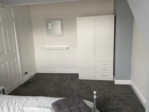 Spacious double bedroom with double wardrobe and drawers