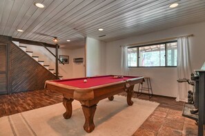 Game room with wood burning fireplace just as you enter through the front door!
