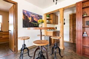 Cute kitchenette area with a pub style dining room table