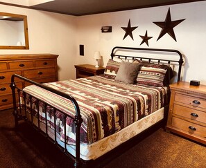 The basement apartment has one bedroom with a queens size bed