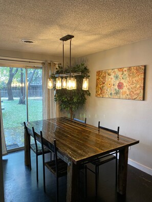 Custom made table & chairs. 2 additional folding chairs in closet to seat 6.