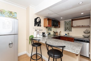 Fully equipped kitchen with a mini dining area 