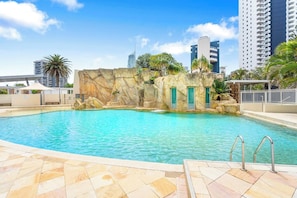 Resort-style outdoor pool with a spa for ultimate relaxation