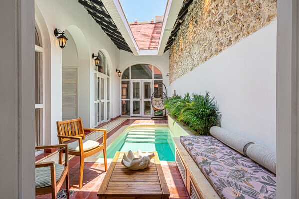 Outdoor furniture at the private pool for an afternoon chill 