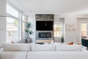 Living area with gas fireplace and TV