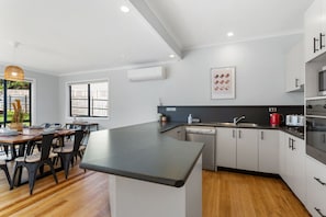 Fully equipped kitchen with coffee machine.