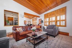 Living room that flows into the dining room and kitchen.