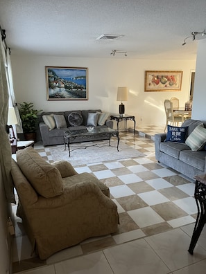 Living room with recessed flooring. There is a step to enter on each side.