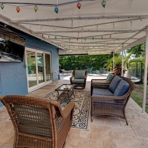 Covered patio, with lights and a 75" smart TV 