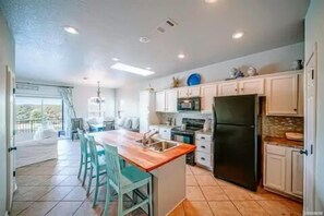 Large eat in kitchen with plenty of room to visit and enjoy the lake view 