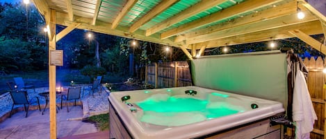 Enjoy the large, covered hot tub with friends or family.