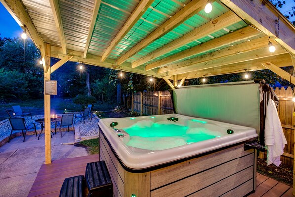 Enjoy the large, covered hot tub with friends or family.