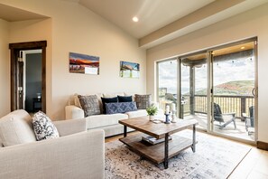 Main Level Living room with deck access and mountain views