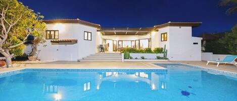 Experience the ultimate in relaxation in our stunning private pool area after sunset. The night sky is a canvas of twinkling stars as you lounge on plush sun loungers, perfectly situated for moonlit views