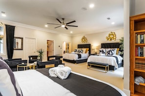 The large suite with golf course views has 4 queen beds and two walk-in closets