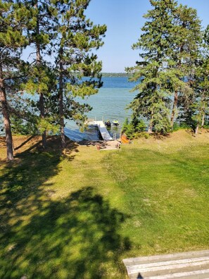 Beach, dock, jet ski lift. Color change in water shows huge sandbar area.