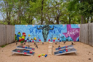 2 cornhole sets, a bocce set, steel ladder ball / bollo, & a 5-foot jumbo jenga!