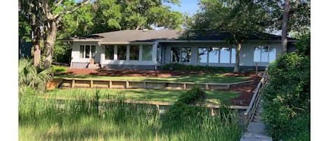 view of the back of the house with dock walkway