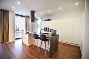 A stunning minimalist kitchen but with all mod cons