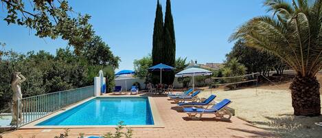 Your private pool with sun loungers. Have a game of Badminton!