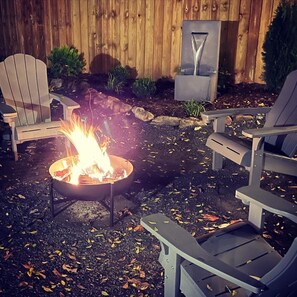 Fire pit with wood provided & fountain in warmer months- add water if needed. 