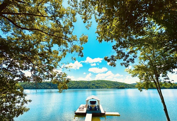 Private dock, tie ups on either side, jet ski port, lounger area, swim up ladder