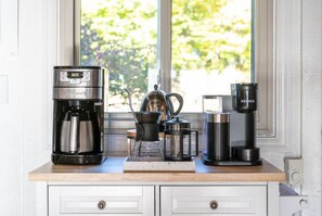 Complete coffee bar with multiple brewing methods and grinder. Free coffee provided!