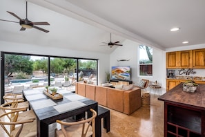 The formal living room opens to the dining area and huge window slider.