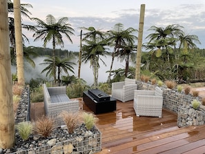 Our firepit sunken lounge is the ideal place to end the day or start the next...