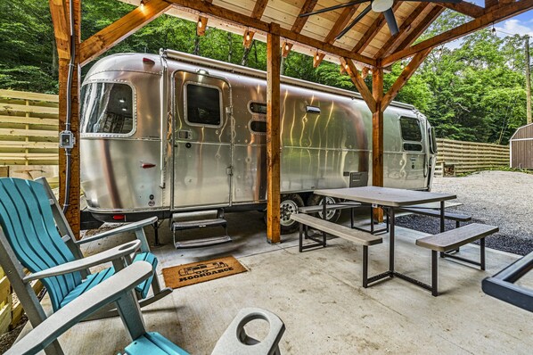 2 polywood rockers sit under the gazebo for relaxing while your pup is in the fenced in dog area.